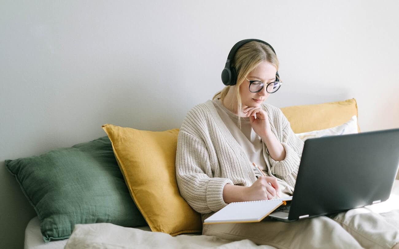 Student in headphones working through listening practice